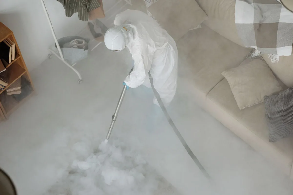 Biohazard cleanup technician in protective equipment, Lonoke, AR